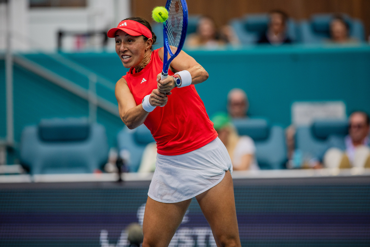 A player lining up a two-handed backhand during the women's final